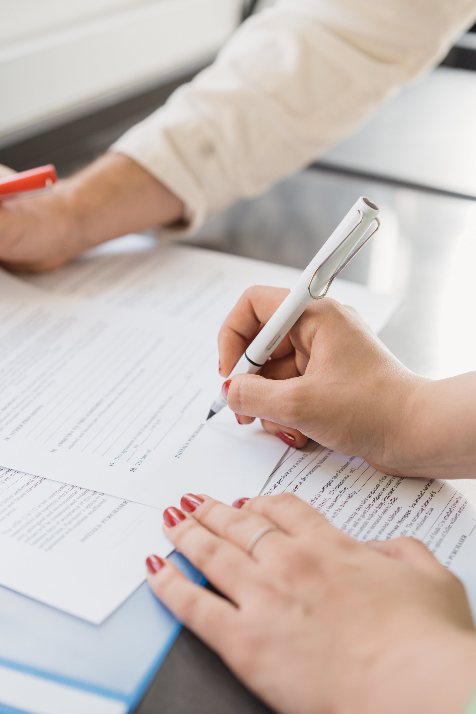 Buyer Signing a Document 